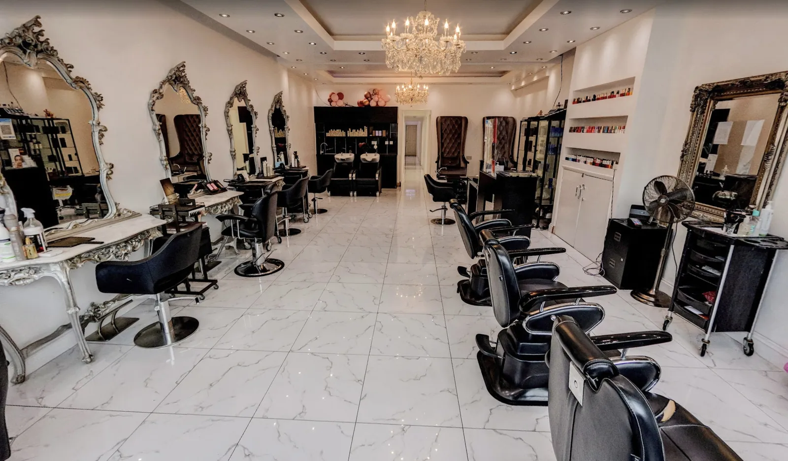 The beauty salon floor at NBA Clinic, with silver mirrors, crystal chandeliers and marble